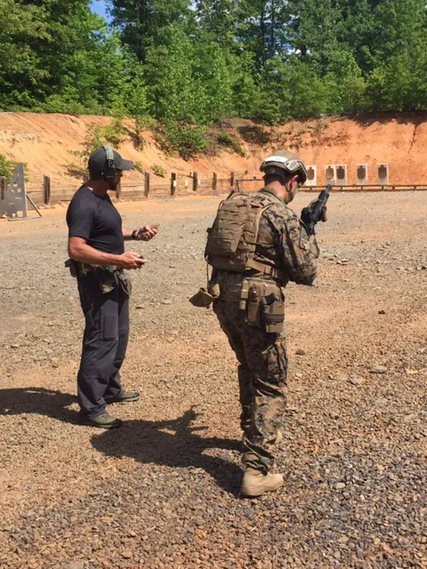 A Marine (right) prepares for a test run during a recent demo of the ONR-sponsored Human Performance EcoSystem (HP EcoSystem) and Joint Marksmanship Assessment Package (JMAP) in Fredericksburg, Virginia. Both systems are designed to measure and enhance Marines’ marksmanship performance. (Photo courtesy of Timothy Parker)