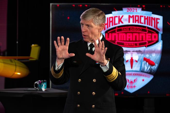 Rear Adm. Lorin Selby, chief of naval research, delivers remarks at the “HACKtheMACHINE” unmanned competition in Alexandria, Va., Nov. 17, 2021. HACKtheMACHINE Unmanned is the first in a series of public-facing technology challenges aimed at accelerating discovery and teambuilding between the DoN, industry and academia for the creation of groundbreaking unmanned and autonomous systems. (U.S. Navy photo by Michael Walls)