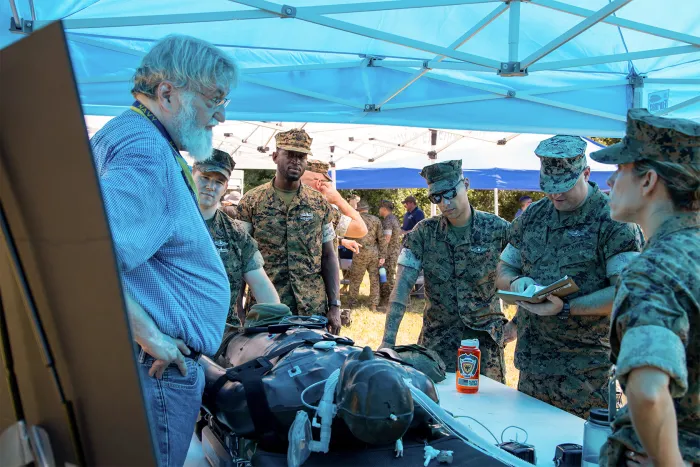 U.S. Marines and U.S. Navy Sailors assigned to II Marine Expeditionary Force are briefed on the Autonomous Casualty Evacuation System during Technology Operational Experimental Exercise (TOEE) 22 on Marine Corps Base Camp Lejeune, North Carolina, August 4, 2022. (U.S. Marine Corps photo by Cpl. Eric Ramirez)
