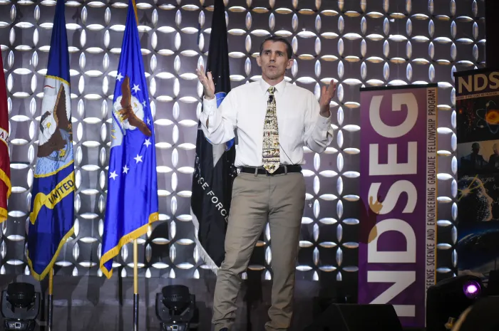 Dr. Jason Stack, director for the Ocean, Atmosphere and Space Research Division of the Office of Naval Research gives a keynote speech at the 2022 DoD National NDSEG Fellows Conference. (U.S. Navy photo by Eric Anderson)