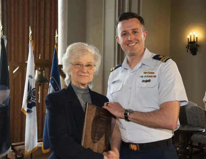 Retired Vice Adm. Ann E. Rondeau, Naval Postgraduate School (NPS) president, presents Coast Guard Lt. Justin P. Goff (right) with a Chief of Naval Research (CNR) Award for Excellence in Intelligent Autonomous Systems. The award honors NPS students performing outstanding academic work related to autonomous systems. (Photo: Naval Postgraduate School)