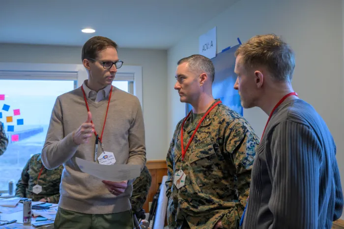 Lt. Col. Joe Murphy (center) speaks with Jason Payne, director, TechSolutions (left) and Russell Wilson, science advisor, ONR Global (right), during a workshop in Duck, North Carolina on the Surf Observation (SUROB) Tool. (photo by Michael Walls)