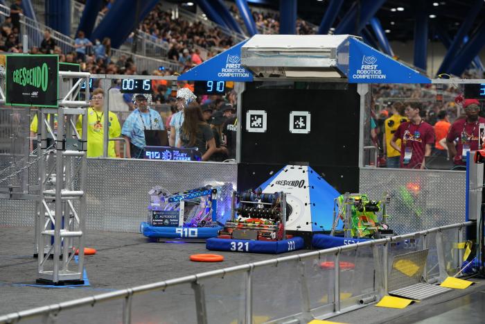 Robots do battle during the recent FIRST Robotics Championship in Houston, Texas. The RoboLancers of Central High School, mentored by Naval Surface Warfare Center Philadelphia Division, won a world title at the competition. (Photo: RoboLancers)