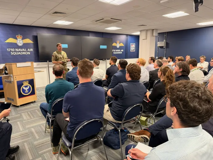 Royal Marine Brigadier Jaimie Roylance, the Royal Navy’s Chief Technology Officer, addresses the audience at the computer vision for maintenance and sustainment hybrid event from Portsmouth Naval Base, U.K. (Courtesy Photo)
