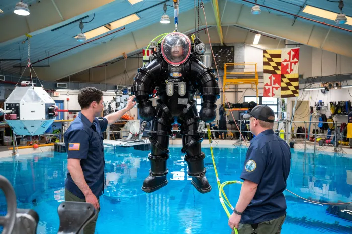 A U.S. Navy diver performs salvage tasks in a test pool