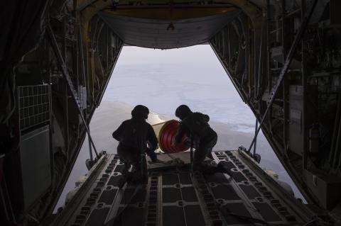 An Air-Deployable Expendable Ice Buoy (AXIB) is deployed in the high Arctic near the North Pole from a Royal Danish Air Force C-130 aircraft operating out of Thule Air Force Base in Greenland, as part of the International Arctic Buoy Program (IABP).