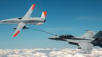 An unmanned Boeing MQ-25 T1 Stingray test aircraft, left, refuels a manned F/A-18 Super Hornet. (U.S. Navy photo courtesy of Boeing)