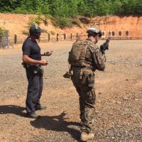 A Marine (right) prepares for a test run during a recent demo of the ONR-sponsored Human Performance EcoSystem (HP EcoSystem) and Joint Marksmanship Assessment Package (JMAP) in Fredericksburg, Virginia. Both systems are designed to measure and enhance Marines’ marksmanship performance. (Photo courtesy of Timothy Parker)