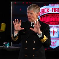 Rear Adm. Lorin Selby, chief of naval research, delivers remarks at the “HACKtheMACHINE” unmanned competition in Alexandria, Va., Nov. 17, 2021. HACKtheMACHINE Unmanned is the first in a series of public-facing technology challenges aimed at accelerating discovery and teambuilding between the DoN, industry and academia for the creation of groundbreaking unmanned and autonomous systems. (U.S. Navy photo by Michael Walls)