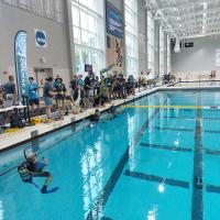 Competitors at the 25th Annual RoboSub competition prepare to test their autonomous underwater vehicles (AUVs) in a swimming pool July 31, 2022, at College Park, Maryland. RoboSub is an international robotics competition, where student teams design, build, test and operate their own robotic submarines— autonomous underwater vehicles (AUVs)—in challenging underwater environments. (Courtesy Photo)