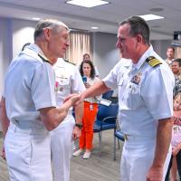 Chief of Naval Research Rear Adm. Lorin Selby (left) and new NavalX Director Capt. Casey Plew exchange handshakes during the NavalX change-of-office ceremony on Sept. 13, 2022. The ceremony welcomed Plew, who took the reins from Capt. Benjamin Van Buskirk. NavalX serves the U.S. Navy and Marine Corps as an innovation and agility cell, supporting and connecting initiatives across the DoD. (U.S. Navy photo by Michael Walls)