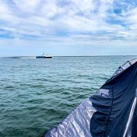 Vessels participate in an ONR SCOUT-sponsored experimentation event at Joint Expeditionary Base Little Creek-Fort Story, Virginia, at the entrance of the Chesapeake Bay. (U.S. Navy photo by Max Hopkins, Demonstration Assessment Team, Naval Surface Warfare Center Indian Head Division)