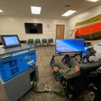 A U.S. Navy aviator receives training on the TS-872 Breathing Dynamics Trainer at the Naval Survival Training Institute in Orlando, Florida. The TechSolutions-sponsored TS-872 allows aviators to experience the effects of breathing issues in a safe training environment, such as hyperoxia (too much oxygen) and excessive inhalation/exhalation pressures.