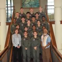 Some of the participants in the Navy and Marine Corps Junior Reserve Officer Training Corps Flight Academy attended a recent graduation ceremony at Delaware State University in Dover, Delaware. At bottom left is Alexandra “Sandy” Landsberg, Naval STEM Coordination Office executive and division director in ONR's C5ISRT Department. At bottom right is William H. Ellis Jr, program officer, Naval STEM Coordination Office. (Courtesy photo)
