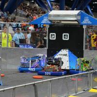 Robots do battle during the recent FIRST Robotics Championship in Houston, Texas. The RoboLancers of Central High School, mentored by Naval Surface Warfare Center Philadelphia Division, won a world title at the competition. (Photo: RoboLancers)