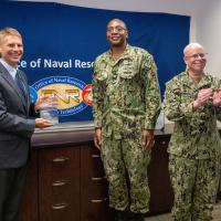 ONR's Peter Squire (left), Ph.D, program officer in the Warfighter Performance Department received two 2025 Dr. Delores M. Etter Top Scientist and Engineer awards for his contributions to warfighter lethality and readiness during a virtual awards ceremony on June 25th. The awards were presented by ONR's Chief of Naval Research, Rear Adm. Kurt Rothenhaus (right) and Assistant Chief of Naval Research Capt. David Murray (center). (U.S. Navy Photo by Micheal Walls.)