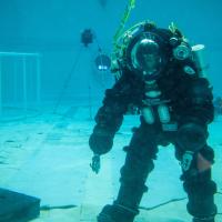A U.S. Navy diver performs salvage tasks in a test pool