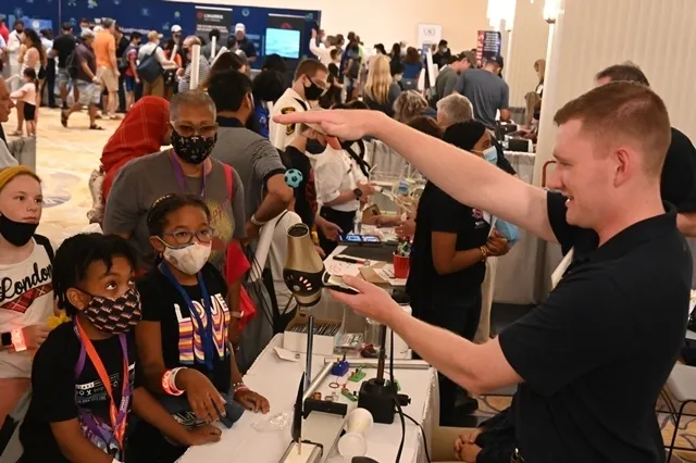 Attendees watch a science demonstration during the Navy League STEM Expo, held Sunday, Aug. 1, at the Gaylord National Resort and Convention Center in National Harbor, Maryland. The free event gave local students the opportunity to engage and be inspired by all things STEM—or science, technology, engineering and math. It also enabled them to learn about a deadline extension and potential prizes for the Naval Horizons student essay contest—organized by the Department of the Navy’s Naval STEM Coordination Off